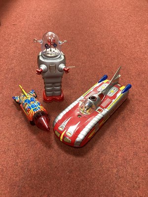 Lot 530 - Three Modern Tinplate Space Toys.