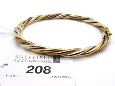 Lot 208 - A 9ct Tri-Colour Gold Hinged Bangle, of...