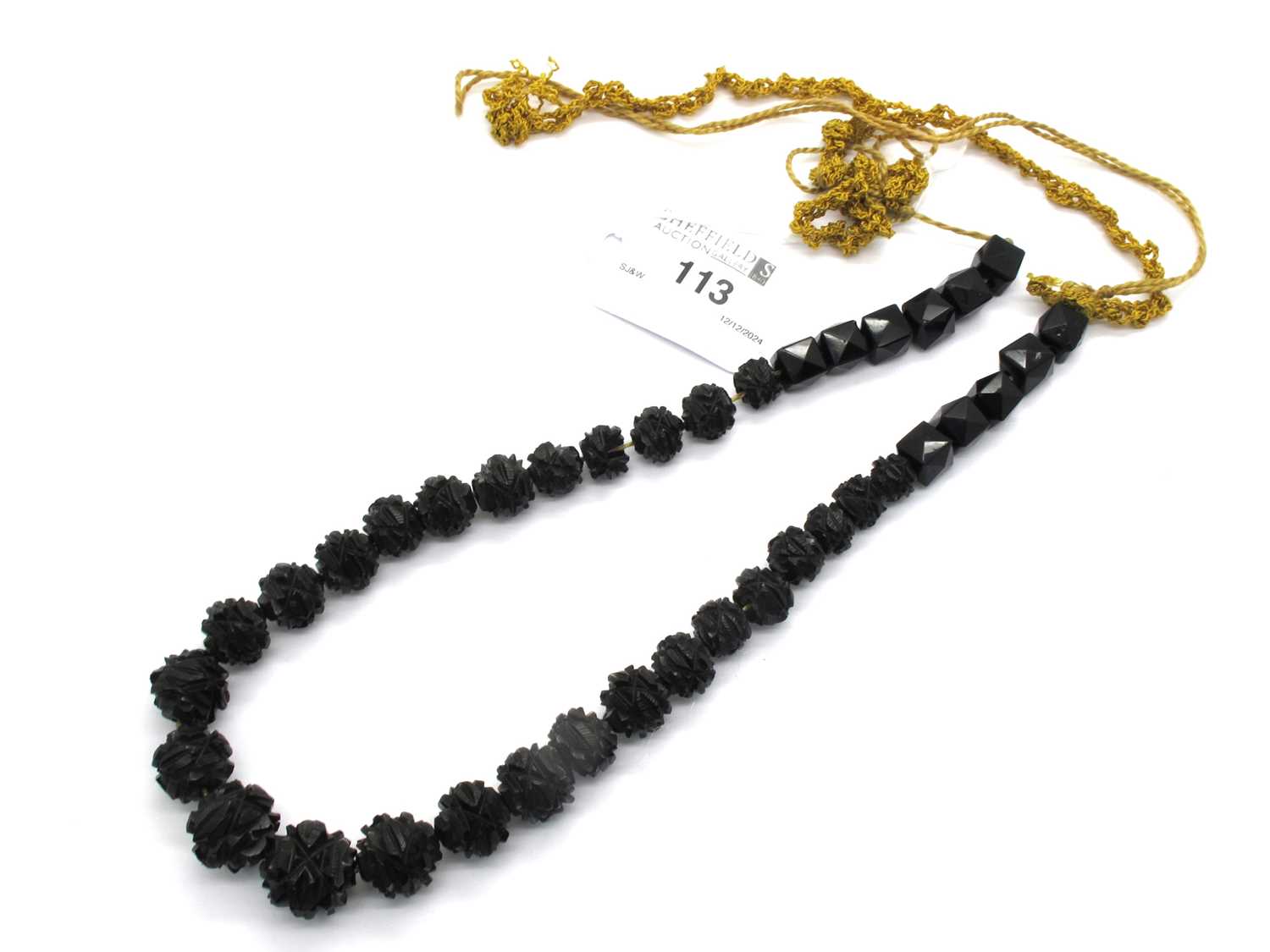 Lot 113 - A Victorian Mourning Jet Coloured Lariat Style...