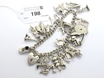 Lot 198 - A Chunky Curb Link Charm Bracelet, suspending...