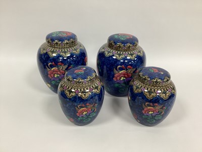 Lot 1037 - A Pair of Losol Ware Pottery Ginger Jars and...