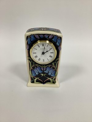 Lot 1110 - A Moorcroft Pottery Clock, painted in the...