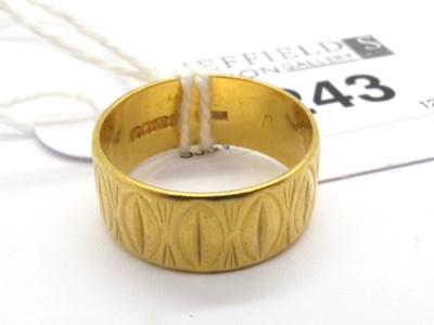 Lot 243 - A Wide 22ct Wedding Band, off textured design...