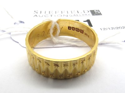 Lot 241 - An 18ct Gold Wedding Band, of textured design...