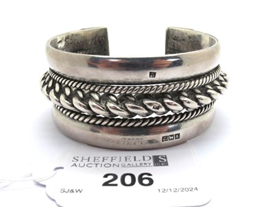 Lot 206 - A Wide Cuff Style Bangle, with rope twist...