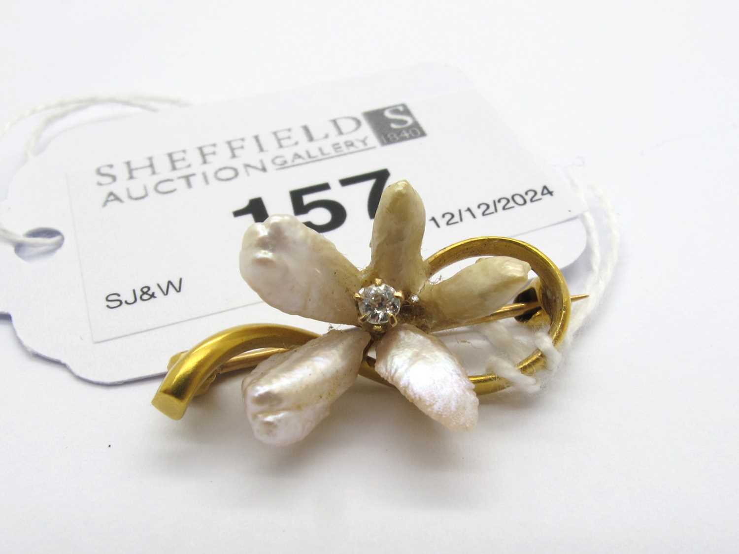 Lot 157 - A Baroque Pearl Bar Brooch, of flowerhead...