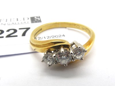 Lot 227 - An 18ct Gold Three Stone Diamond Crossover...