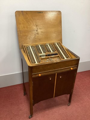 Lot 1272 - A 1930's Oak Cased Wheeled Cabinet of Optician'...