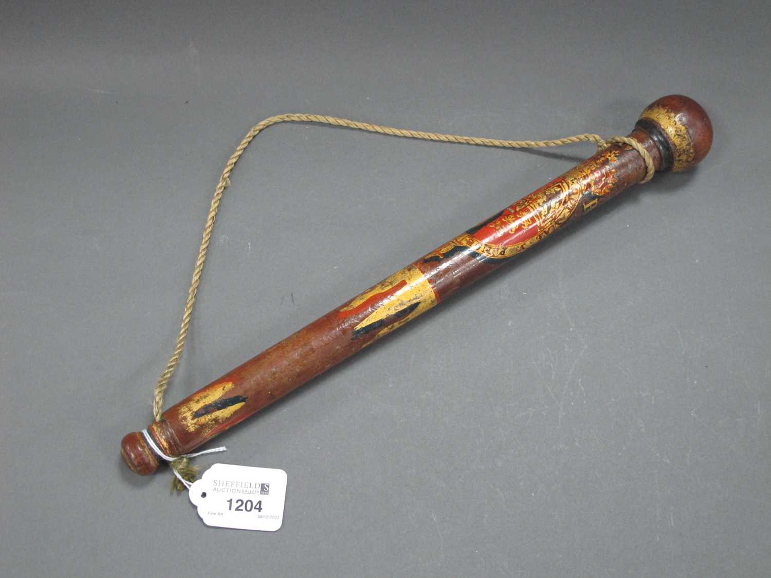 Lot 1204 - A George IV Wooden Baton, with painted Royal...