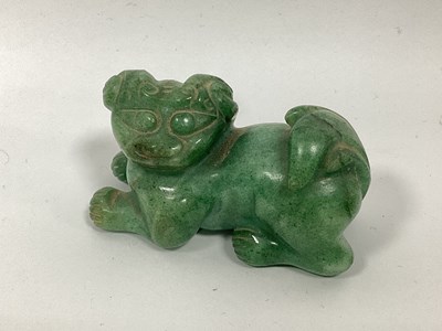 Lot 1159 - A Green Hardstone Chinese Dog of Fo, 8cm long.