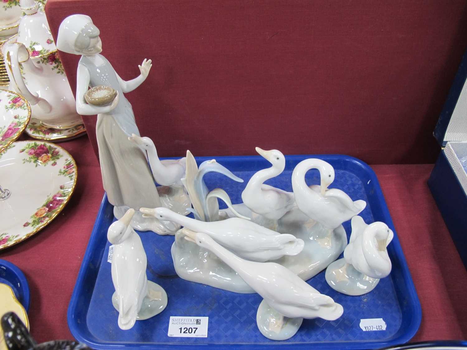 Lot 1207 - Lladro figurines to include group of three...