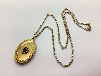 Lot 110 - A 9ct Gold Stone Set Oval Locket Pendant, the...