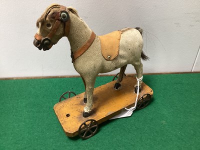 Lot 325 - Early XX Century Horse on Wheels, 16cm long,...