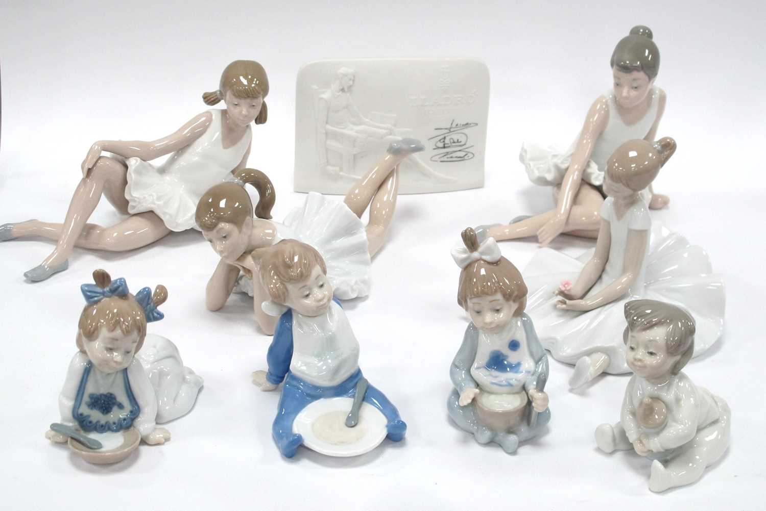 Lot 1222 - Nao ballerina figurines all seated, four...