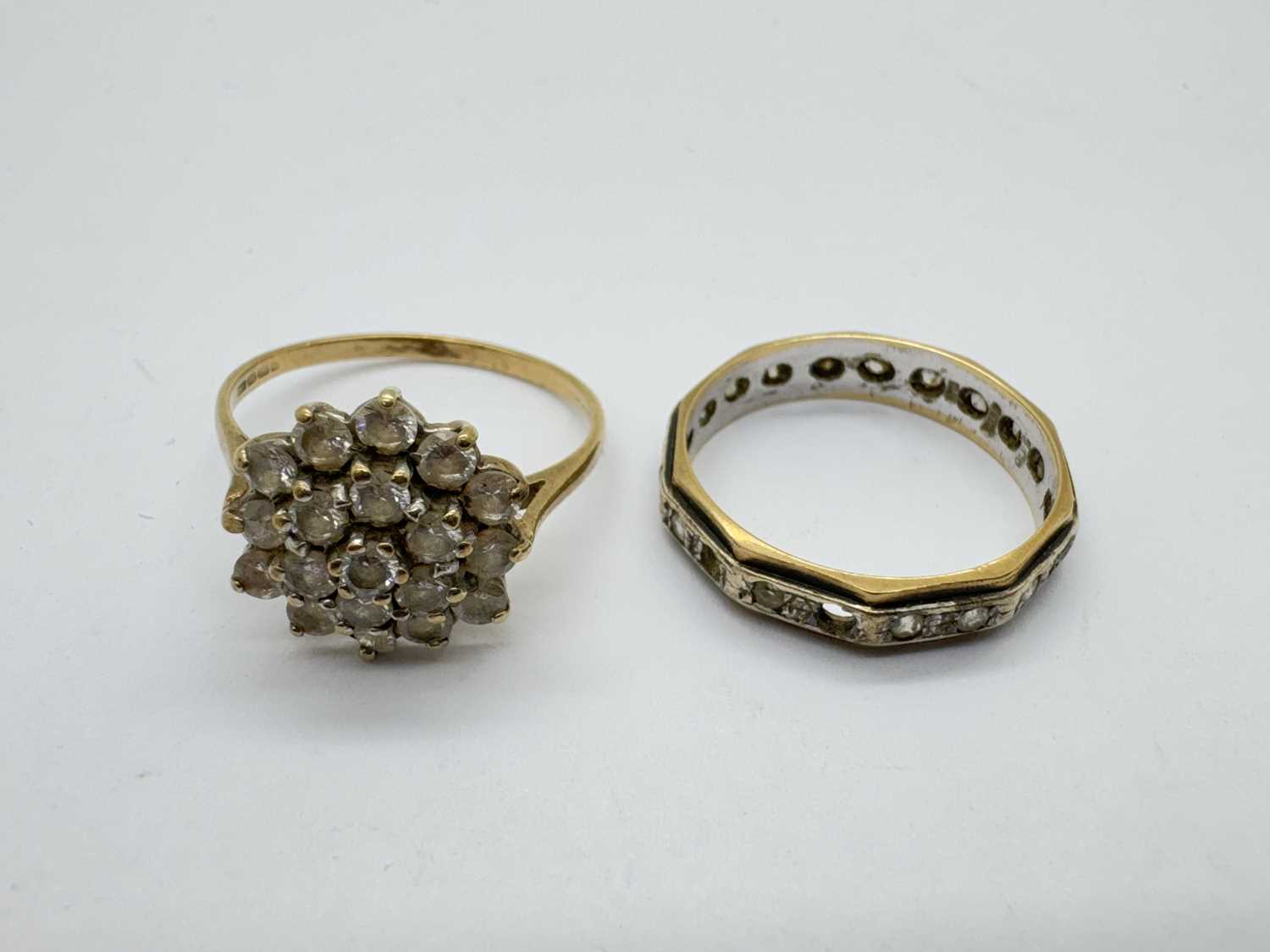 Lot 28 - A 9ct Gold Two Tone Stone Set Eternity Band,...