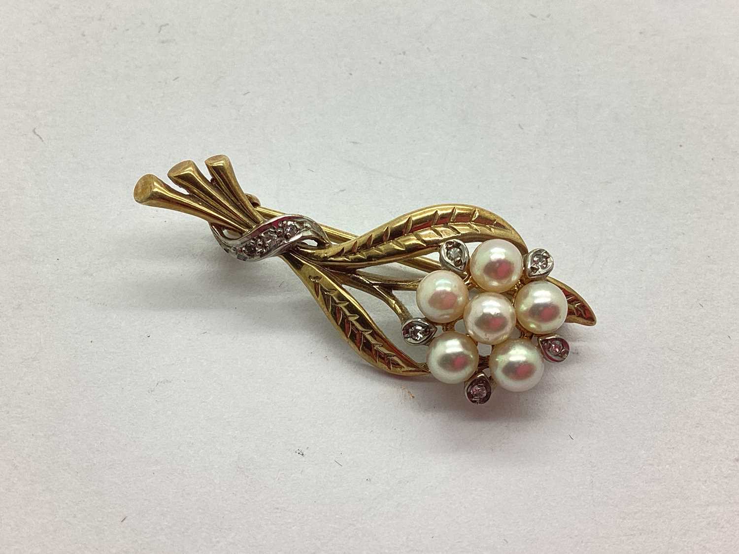 Lot 57 - A 9ct Gold Freshwater Pearl Bead and Diamond...