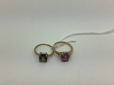 Lot 527 - Two Modern Single Stone Dress Rings, each...