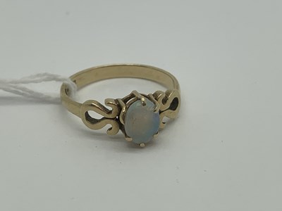 Lot 493 - A 9ct Gold Single Stone Opal Ring, claw set...