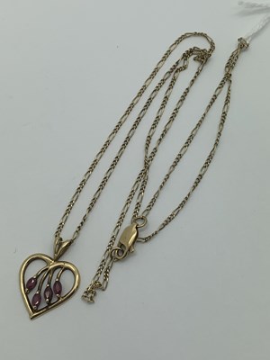 Lot 169 - A Modern 9ct Gold Ruby Set Heart Shape Pendant,...