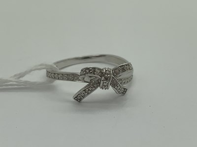 Lot 504 - A Modern 9ct White Gold Diamond Set Bow Dress...