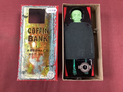 Lot 646 - A Japanese Tinplate Clockwork coffin bank, boxed