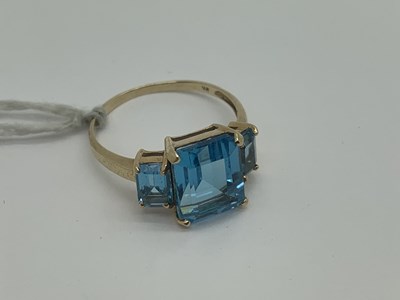 Lot 509 - A Modern Three Stone Dress Ring, claw set,...