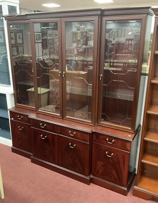 Lot 1483 - A Breakfront Display Cabinet, base with four...