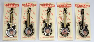 Lot 1317 - The Beatles Guitar Brooches, featuring images...