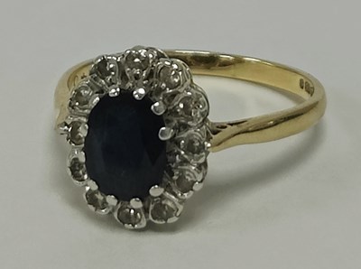 Lot 45 - A 9ct Gold Stone Set Cluster Ring, the oval...