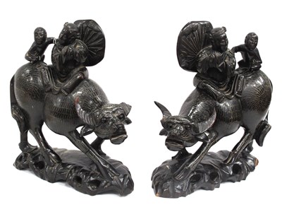 Lot 1330 - Oriental - Pair of carved hardwood buffalo...