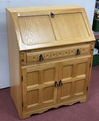 Lot 1533 - Light Oak Bureau, with a panelled fall, fitted...