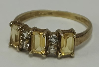 Lot 38 - A Stone Set Dress Ring, the three emerald cut...