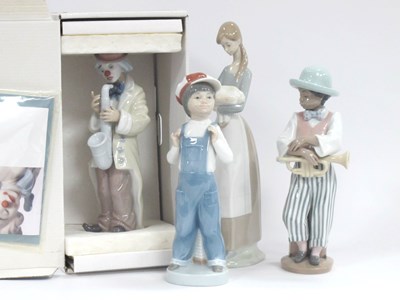 Lot 1238 - Lladro figurines to include Sad Sax boxed, Boy...