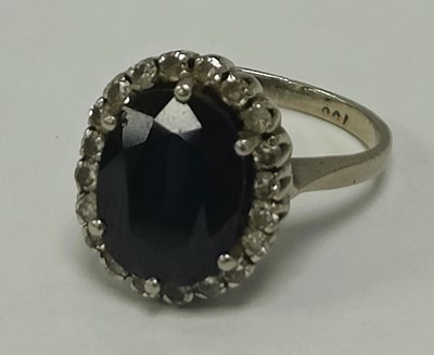 Lot 42 - A Diamond and Stone Set Cluster Ring, the oval...