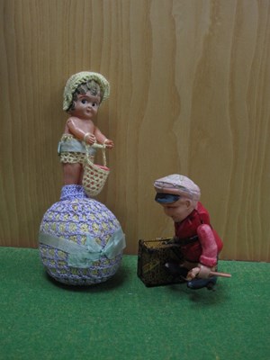 Lot 894 - An early 20th century celluloid wind up...