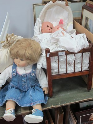 Lot 1132 - Fiba Doll, three composition dolls, dolls, cot,...