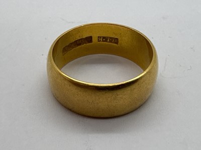 Lot 66 - A 22ct Gold Wide Wedding Band, of plain design...