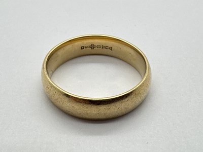 Lot 69 - A 9ct Gold Wide Wedding Band, of plain design,...