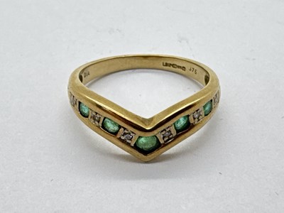 Lot 67 - A 9ct Gold Emerald and Diamond Wishbone Ring,...