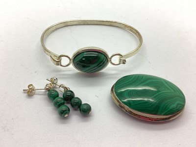 Lot 117 - A Malachite Inset Oval Panel Brooch, of...