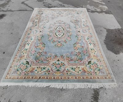 Lot 1525 - Chinese Wool Tassled Carpet, allover floral...