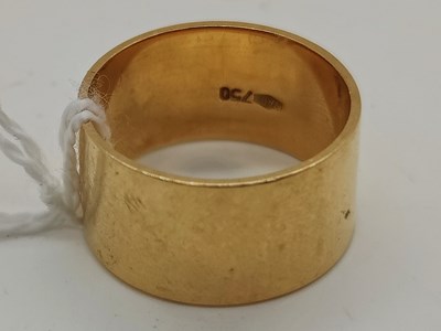 Lot 51 - A Plain Wide Wedding Band, stamped "750" "7AR"...