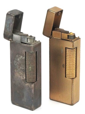 Lot 1297 - Dunhill Lighters, gold plated and silver...