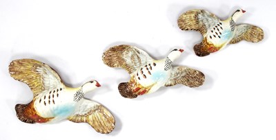 Lot 1064 - Three Graduated Beswick Flying Partridges,...