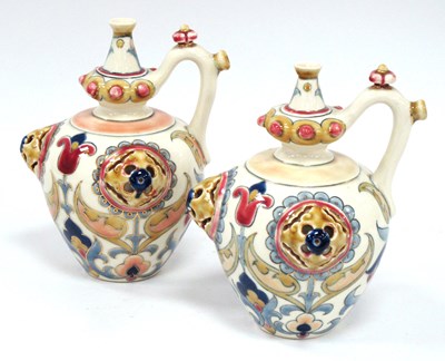 Lot 1086 - A Pair of Zsolnay Pecs Pottery Ewers, of...