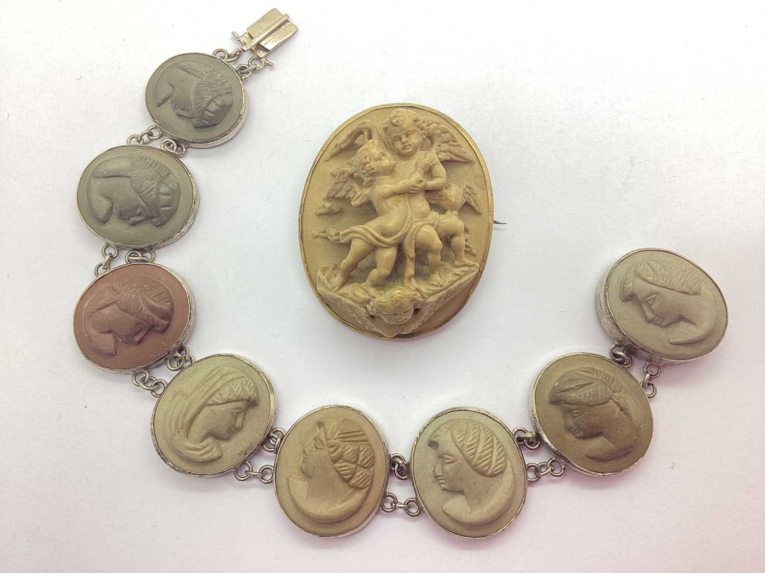 Lot 161 - A Victorian Lava Cameo Panel Bracelet, oval...