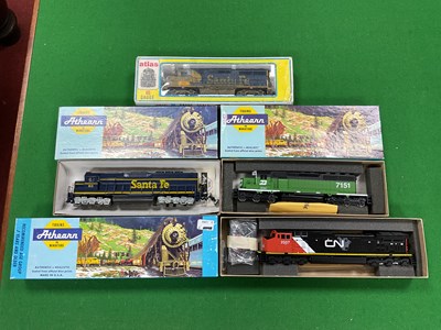 Lot 512 - Four boxed HO scale North American Diesel...