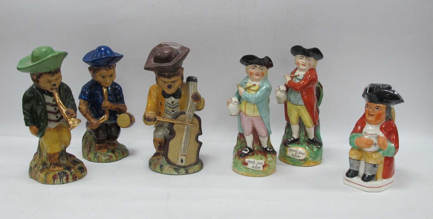 Lot 1137 - Three Pottery Monkey Musician Figures, two...