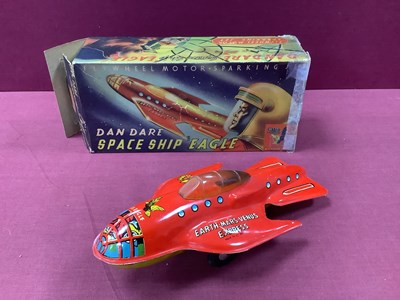 Lot 883 - A 1950s Eagle Dan Dare Tinplate Friction Drive...