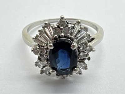Lot 223 - A Sapphire and Diamond Abstract Cluster Ring,...